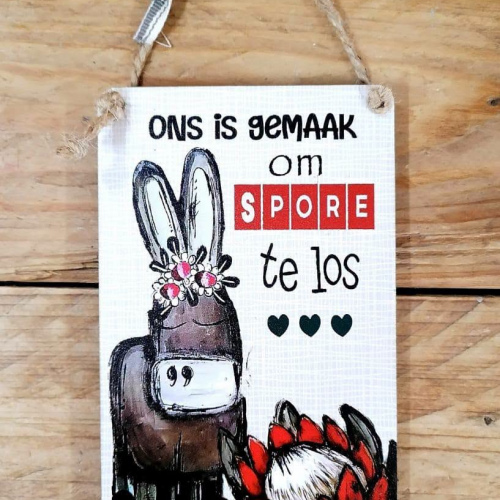Hangbordjie Ons is gemaak om spore te los 